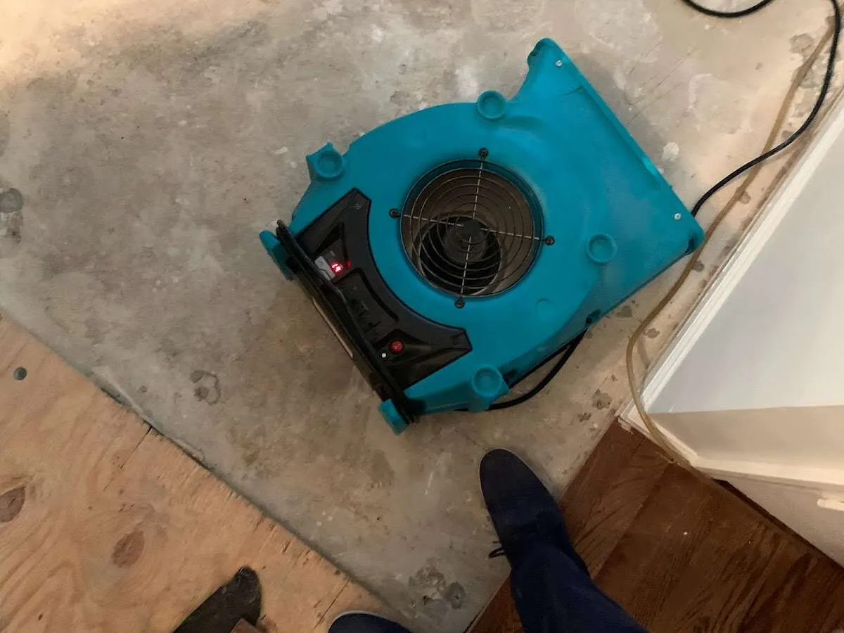 Air mover drying subfloor during Leak Detection & Repair in Big Spring